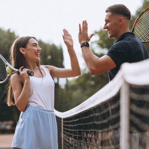 young-couple-playing-tennis-court